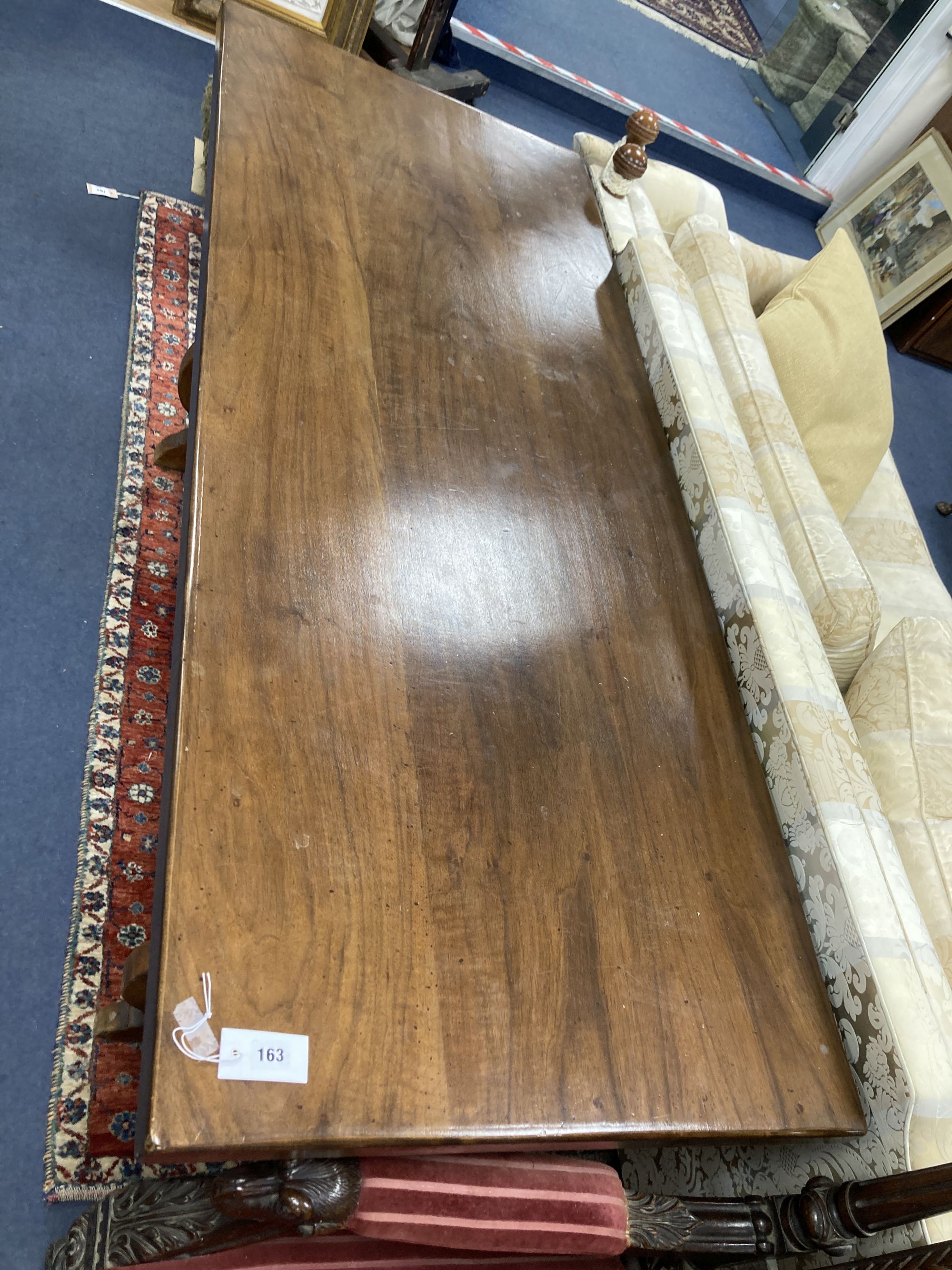 An 18th century Tuscany walnut dining table, with a later top, width 175cm, depth 70cm, height 80cm